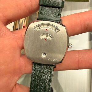 Gucci Grip Stainless Steel Watch with a green leather strap